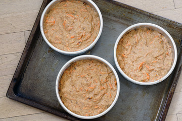 Raw batter for a vegan carrot cake in a cake mold