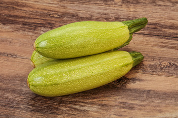 Young tasty zucchini over board