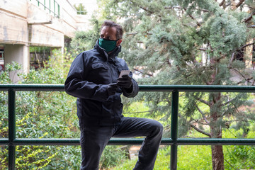 Man wearing mask and gloves during covid 19 pandemic looking worried