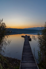 Fototapeta premium fishing boat at pier on Jenoi pond near Diosjeno, Northern Hungary