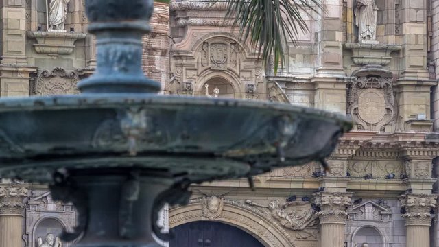 Staue on The Basilica Cathedral of Lima is a Roman Catholic cathedral located in the Plaza Mayor timelapse hyperlapse in Lima, Peru. Close up view to decoration elements