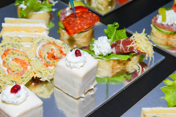 Delicious canapes for party on plate