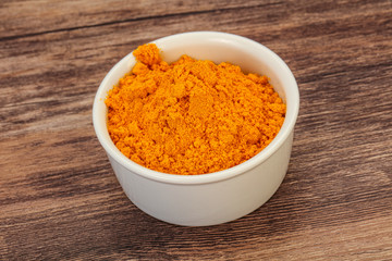 Tumeric powder in the bowl