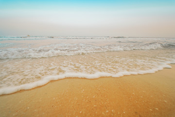 summer season travel from sand beach with wave and blue sky background