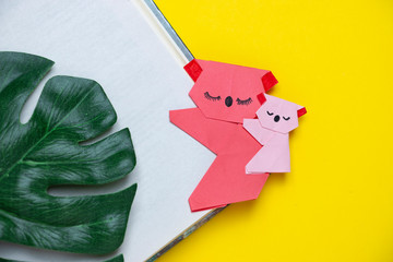 Pink koala made using the origami technique on a yellow background. DIY bookmark. Children's creativity. © Ekaterina Petrukhan