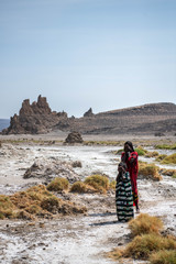 Two children in lake Abbe salt desert