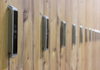 line lockers with numbers and locks in the locker room