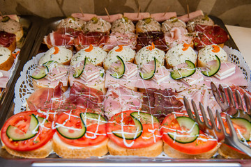 Delicious canapes for party on plate