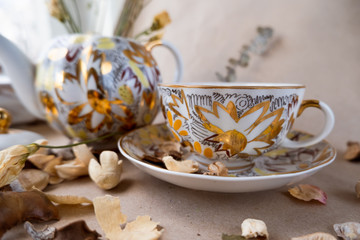 Porcelain dishes with a golden pattern of flowers
