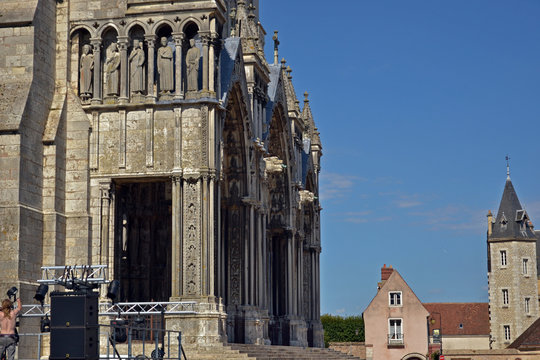 Chartres, France - August 28th 2015 : Facade of the Notre-Dame de Chartres cathedral. The construction of this Gothic monument began in 1194. Focus on an entrance.