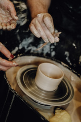 Pottery studio, the process of making mugs of clay