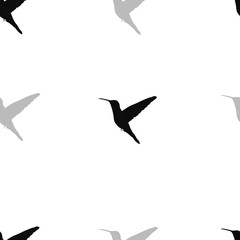 Vector seamless pattern. Hummingbird silhouette. Isolated on a white background. Vector graphics.