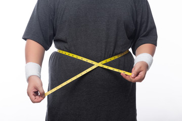 Fat man holding a measurement tape for check out his body isolated on white background.
