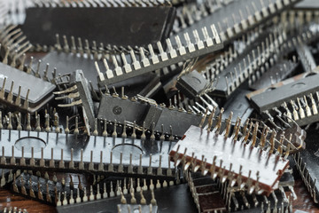 Close up of obsolete used microchips. Close up of electrical waste.