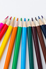 colored pencils on white background