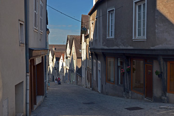 Fototapeta na wymiar Chartres, France - August 28th 2015 : View of a beautiful old street in the city center, near the Cathedral.