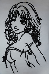 Cross stitch pattern in black and white. The picture embroidered a girl, handmade, hobby.