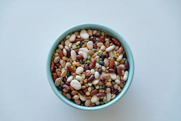 Colorful beans in a blue bowl