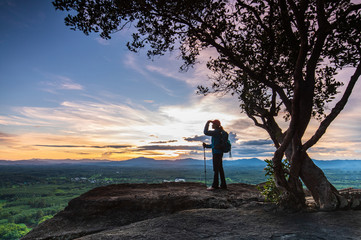 Young  woman hiking on Mountain, Pha Daeng viewpoint, Na Yung Nam Som National park, Udonthani province , Thailand.