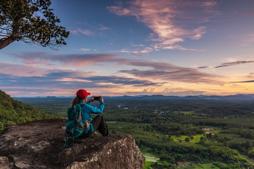 Young  woman hiking on Mountain, Pha Daeng viewpoint, Na Yung Nam Som National park, Udonthani province , Thailand.