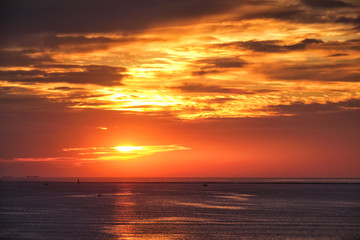 Ocean sunset with boats in sea. Mumbai, India