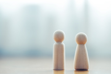 banner of couple wooden doll toy standing together on background, new married life living insurance concept, copy space