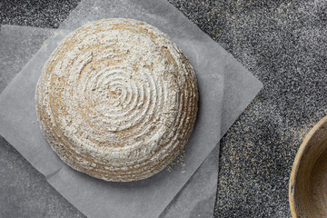 Fototapeta na wymiar Proofing dough in a special basket. Raise the dough before baking. Yeast-free dough. The fermentation process of the dough.