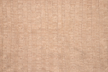 texture in the form of a knitted plaid of beige-brown color
