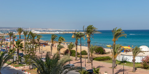 Fototapeta na wymiar Yasmine Hammamet, TUNISIA - JULY 17 2018: A view from Tunisian hotel room on the beach and Mediterranean sea