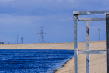 metal safety railing at dam reservoir lookout