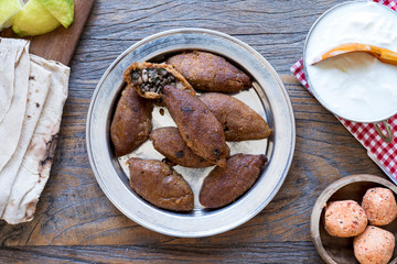 oruk, kibbeh plate over wooden table