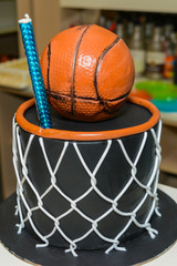 Basketball on birthday cake close up