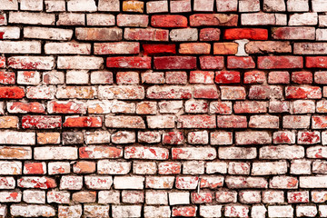 Texture of a brick wall with cracks and scratches which can be used as a background