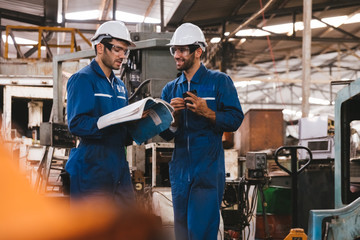 Group of industrial factory maintenance engineers inspect relay protection system using walkie talkie with copy space for your text. Industry, Maintenance, Engineering and construction concept.
