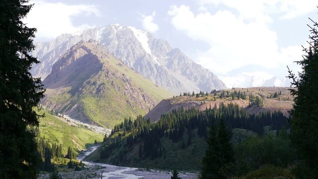 Time lapse zoom out of the beautiful Left Talgar mountain valley with river, rocks and forest in Tian Shan mountains near Almaty city, Kazakhstan