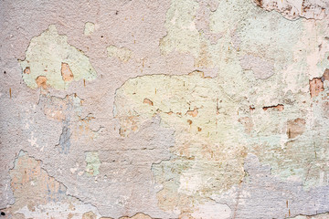 Textuur van een betonnen muur met scheuren en krassen die als achtergrond kunnen worden gebruikt