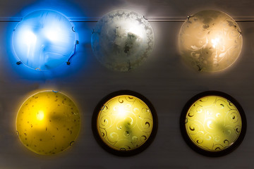 Round multi colored wall sconce lamps in supermarket 
