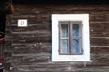 Obraz na płótnie Canvas Window in Log cabin house in Nizna Boca village and municipality in Liptovsky Mikulas district, central Slovakia