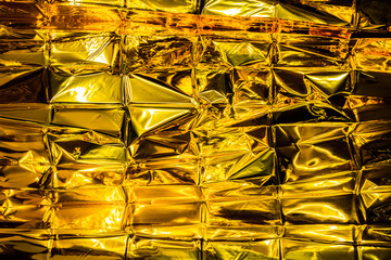 abstract Crumpled golden foil backgound