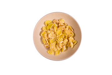 Ceramic plate with cornflakes isolated on a white background. Healthy eating