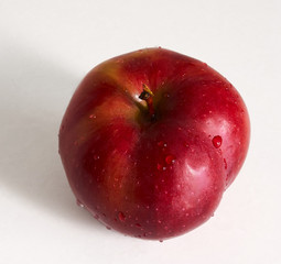 red apple lies on the table