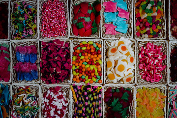 large quantities of sweets of thousands of colors and flavors