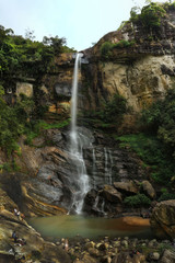Fototapeta na wymiar Beautiful Long Exposure of Greeny Ramboda Falls with clouds in Nuwaraeliya Central Province Sri Lanka