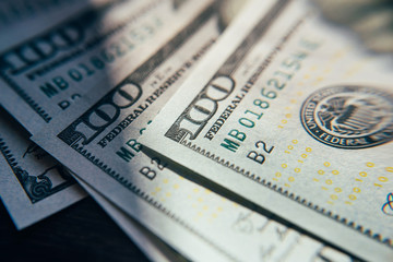 American cash dollars close-up. One Hundred Dollar Banknotes. Soft focus image.