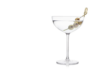 Vodka martini gin cocktail in luxury crystal glass with olives on bamboo stick on white background with reflection.