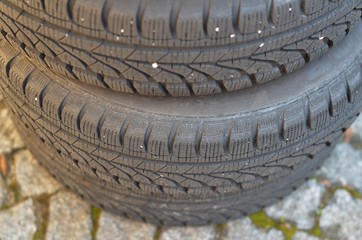 Stack of black car tyres