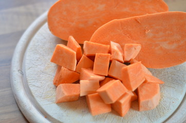 sweet potato cubes on a chopping board