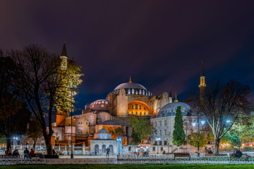 Fototapeta na wymiar Hagia Sofia, beautiful historic landmark in Sultanahmet, Istanbul. Night streets of Istanbul. Old city district Sultan Ahmed square.