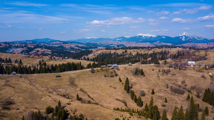 Alpine village settlement of a house on top of a mountain aerial photo Carpathians Ukraine.