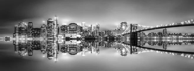 Poster .New York City skyline with skyscrapers at sunset on Brooklyn Bridge black and white version © Creative Clicks
